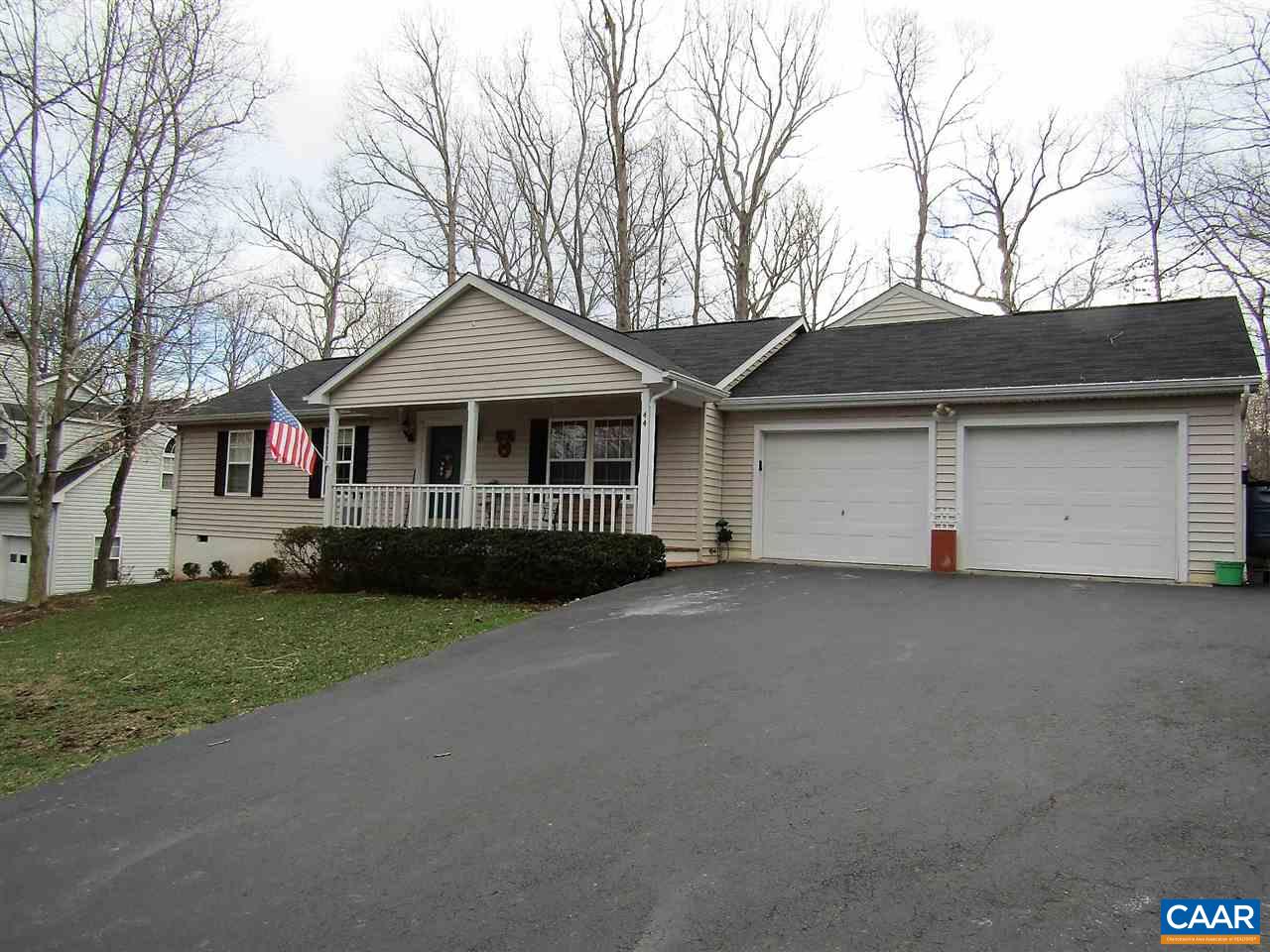 44 Amethyst Road Palmyra, VA 22963 - Photo 1 of 23 a front view of a house with a garden and trees