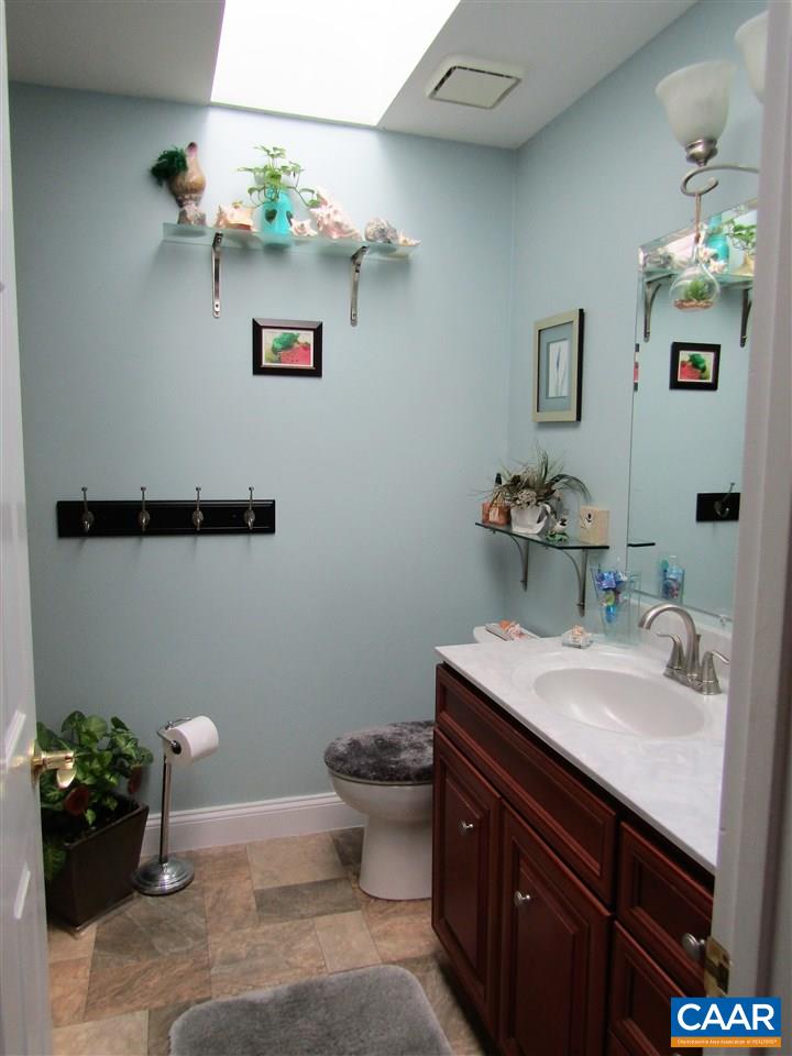 44 Amethyst Road Palmyra, VA 22963 - Photo 15 of 23 a bathroom with a sink mirror and toilet