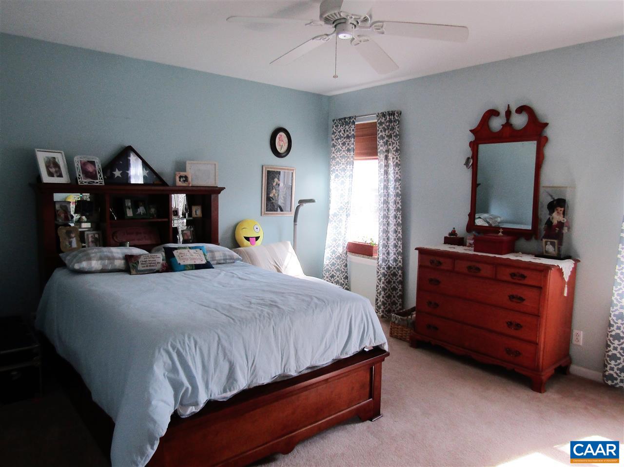 44 Amethyst Road Palmyra, VA 22963 - Photo 16 of 23 a bedroom with a bed and a flat tv screen on dresser