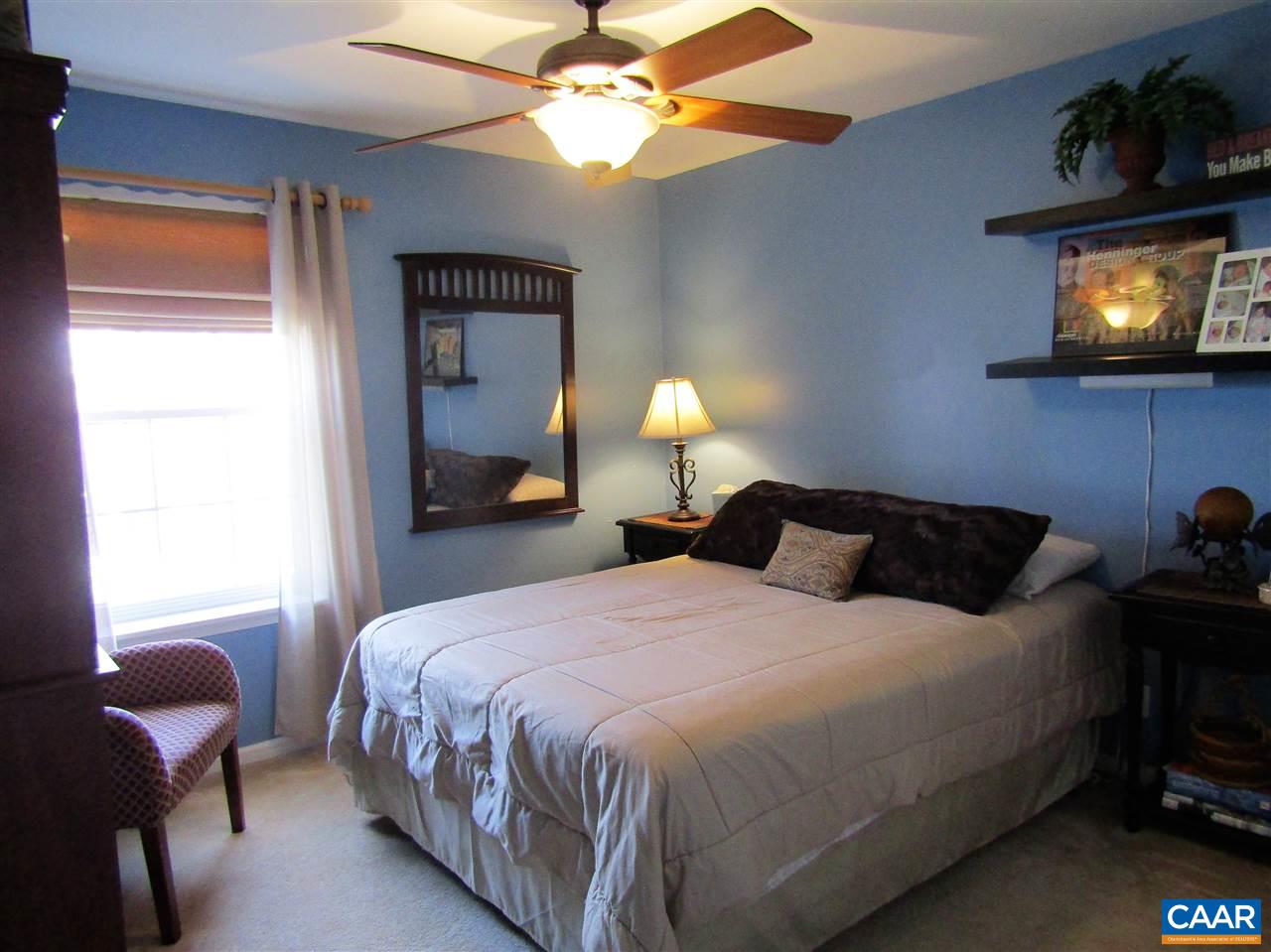 44 Amethyst Road Palmyra, VA 22963 - Photo 18 of 23 a bedroom with a bed and a flat screen tv