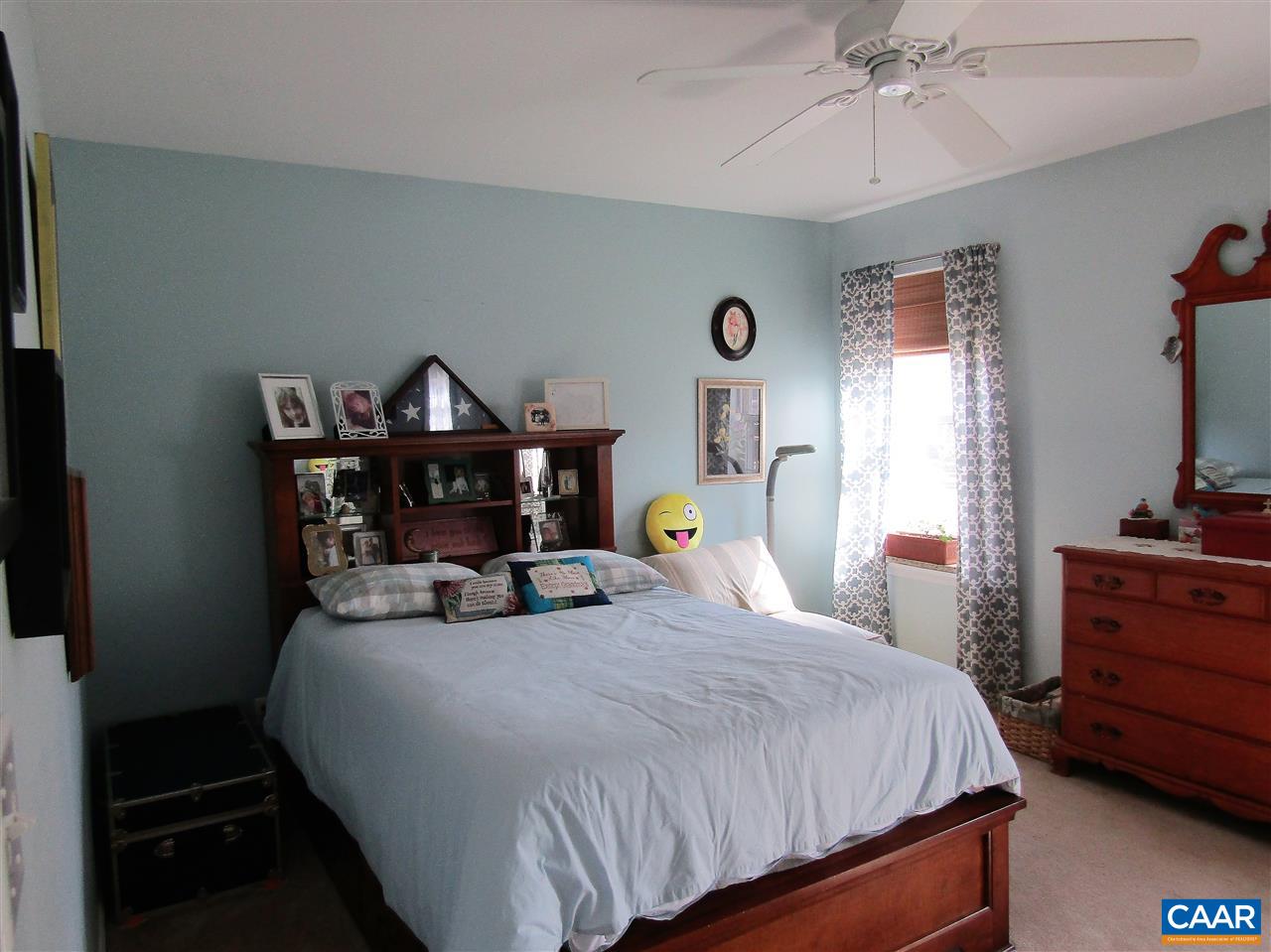 44 Amethyst Road Palmyra, VA 22963 - Photo 19 of 23 a bedroom with a bed and wooden floor
