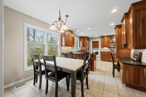 a view of a dining room with furniture window and outside view