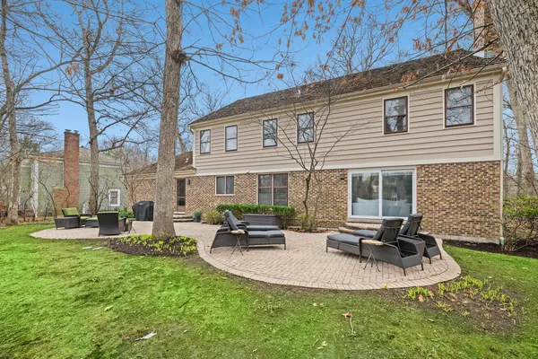 a view of a house with backyard porch and sitting area