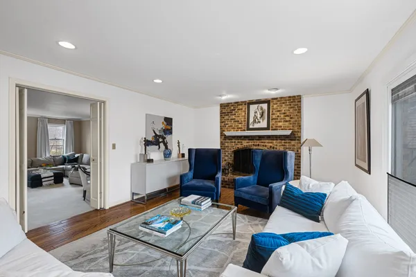 a living room with furniture and a fireplace