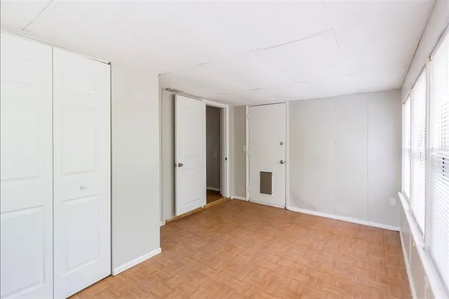 a view of hallway with a ceiling fan