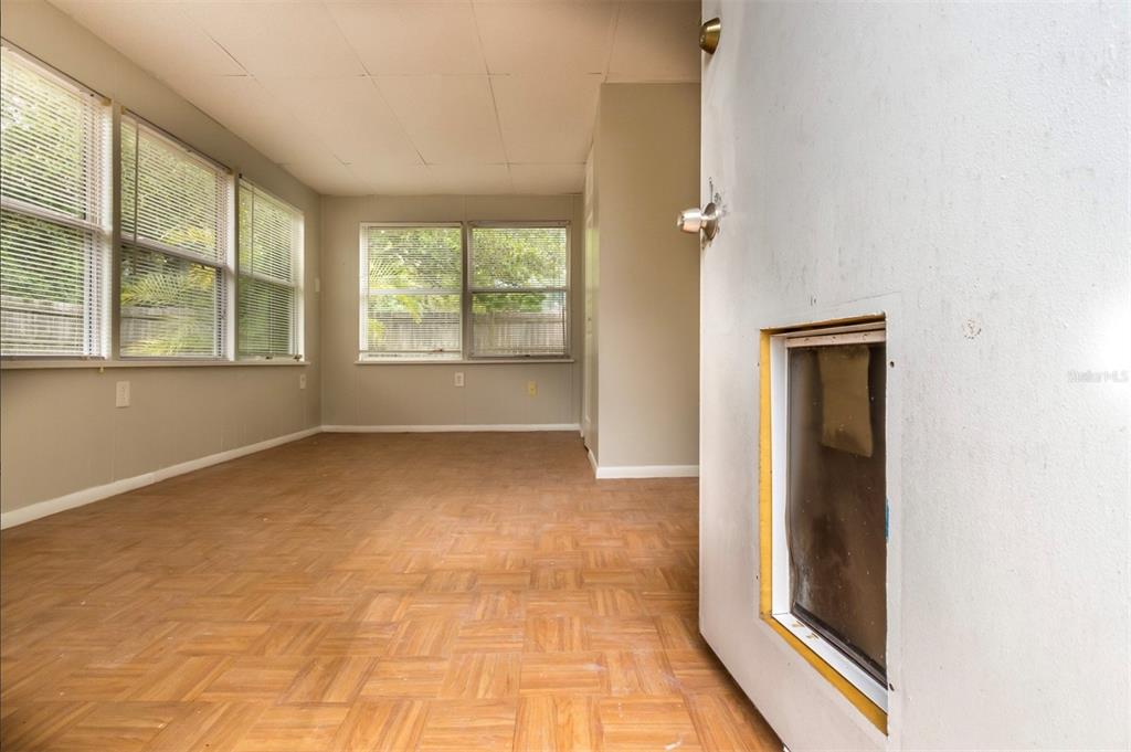 7735 Rottingham Road Port Richey, FL 34668 - Photo 14 of 24 an empty room with windows