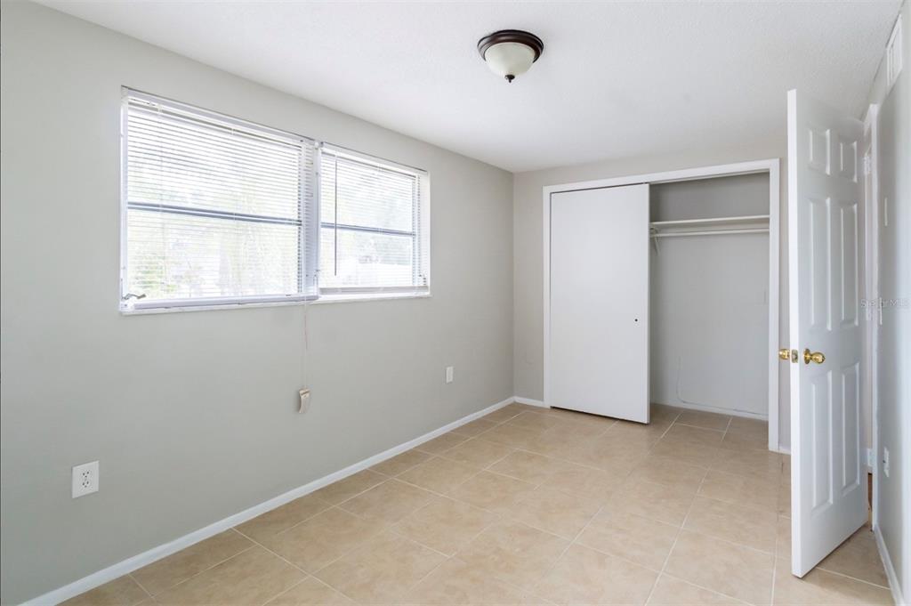 7735 Rottingham Road Port Richey, FL 34668 - Photo 18 of 24 an empty room with windows