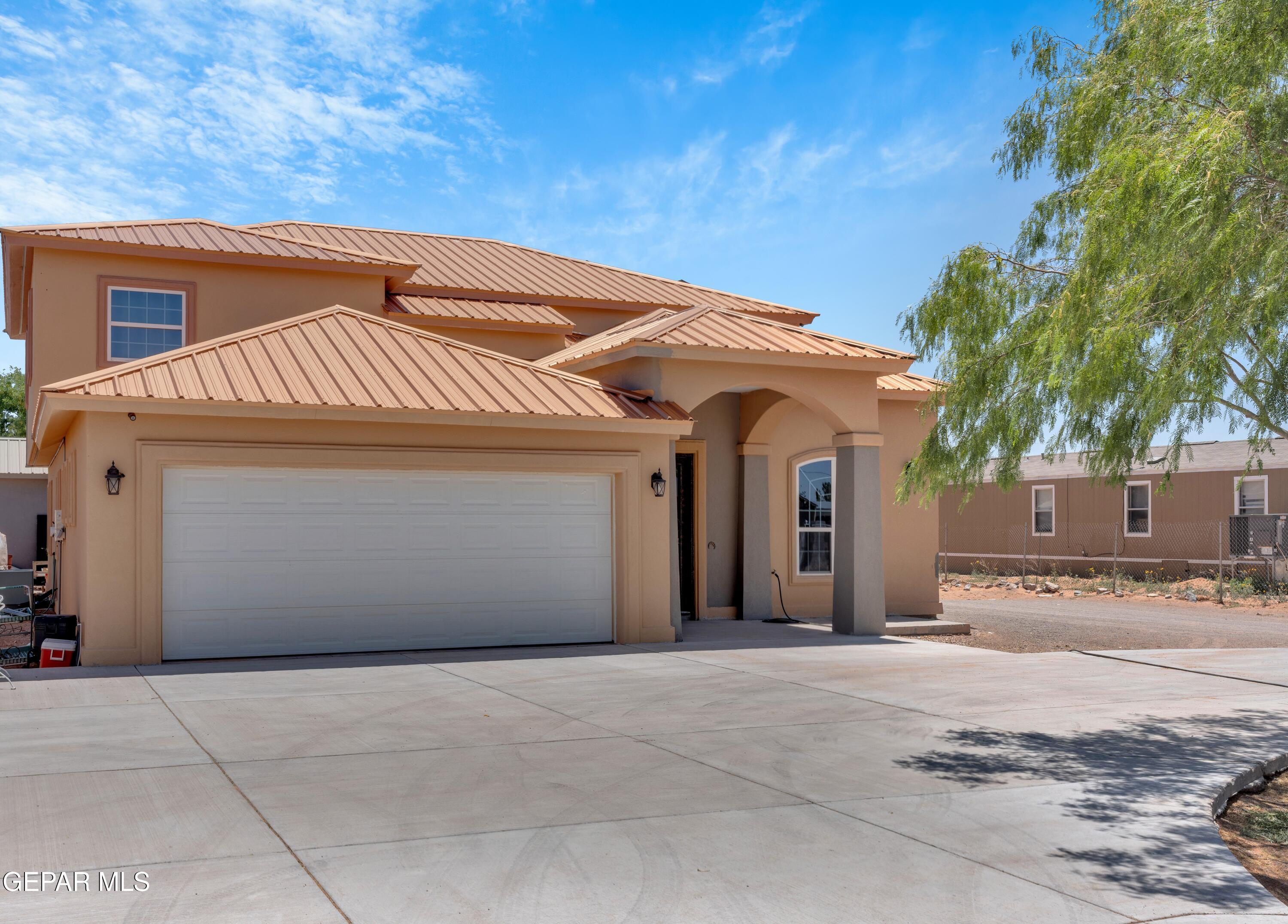 5378 Krag Street El Paso, TX 79938 - Photo 2 of 63 a front view of a house with a yard