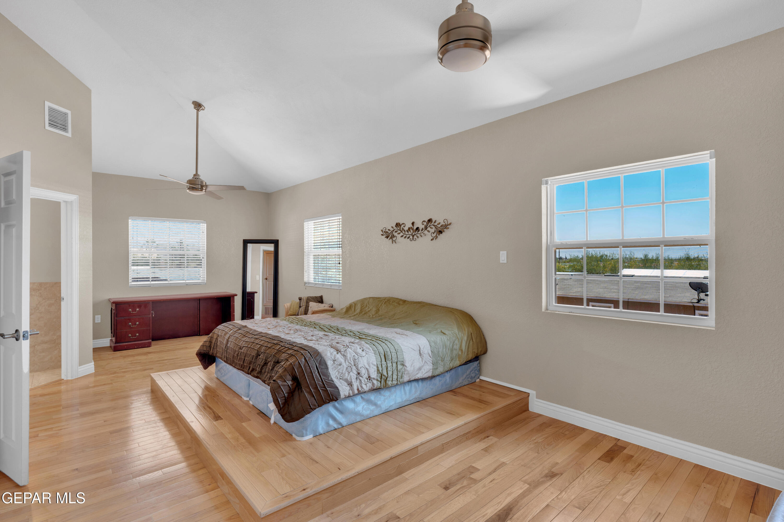 5378 Krag Street El Paso, TX 79938 - Photo 36 of 63 a bedroom with a large bed and a window