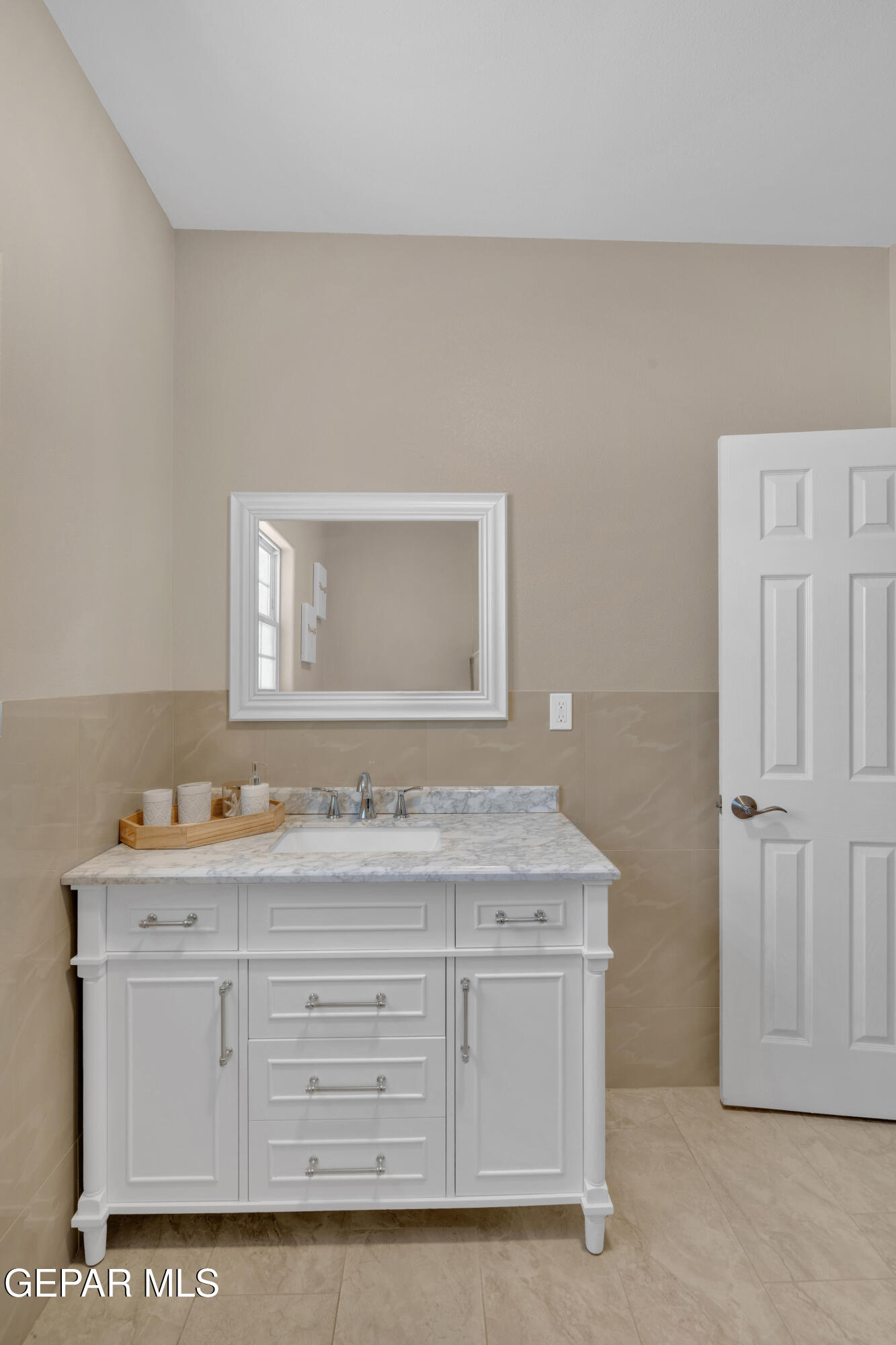 5378 Krag Street El Paso, TX 79938 - Photo 41 of 63 a bathroom with a sink vanity and mirror