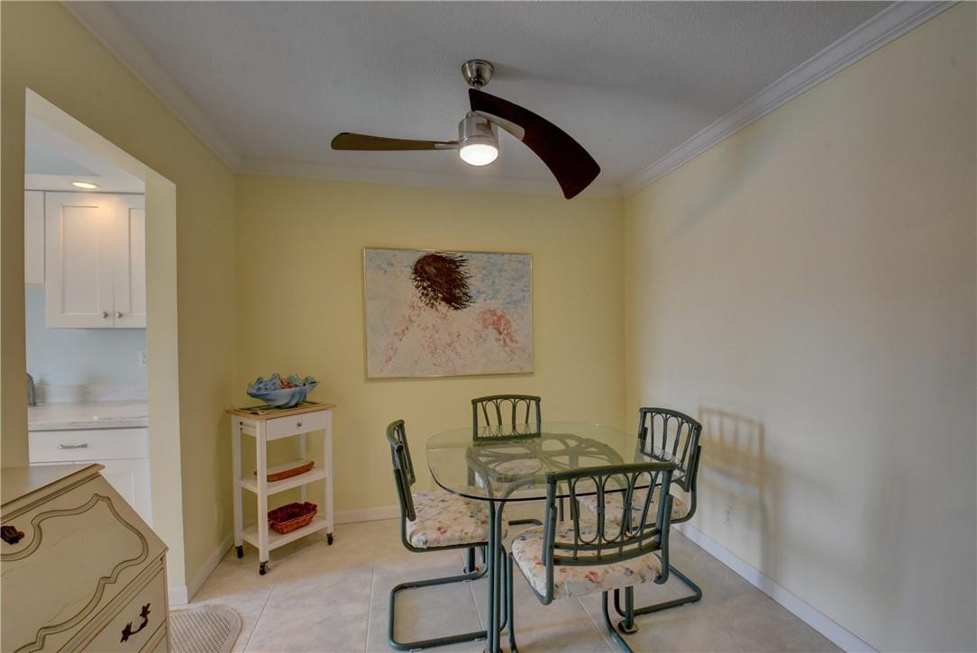 801 North Riverside Drive, Unit 3C Pompano Beach, FL 33062 - Photo 27 of 34 EASY ACCESS TO KITCHEN FROM DINING AREA