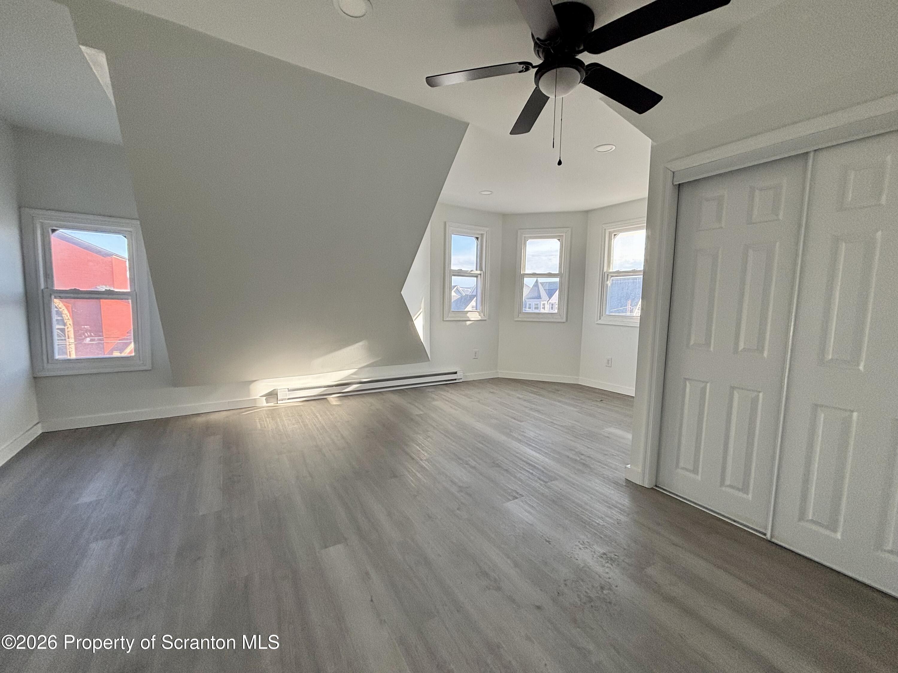 218 South Main Avenue Scranton, PA 18504 - Photo 9 of 9 wooden floor in an empty room with a window