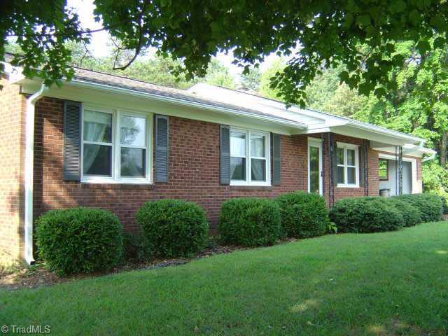 8119 East Harrell Road Oak Ridge, NC 27310 - Photo 1 of 9 Exterior Front.