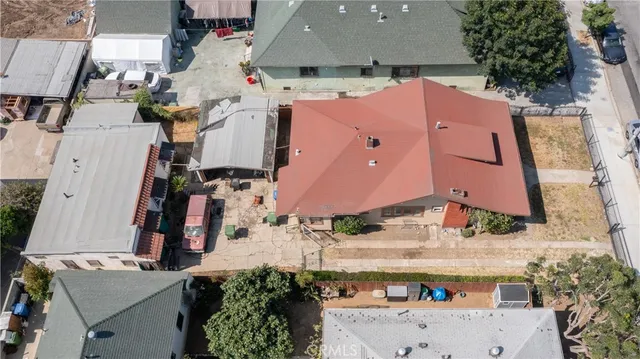 an aerial view of houses with outdoor space