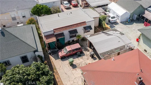 an aerial view of a house with a yard