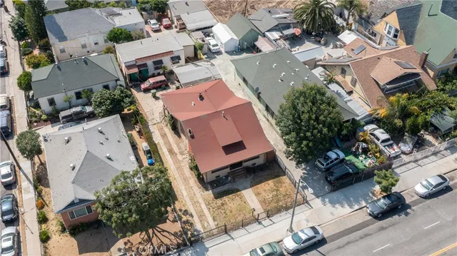 an aerial view of a house with a yard