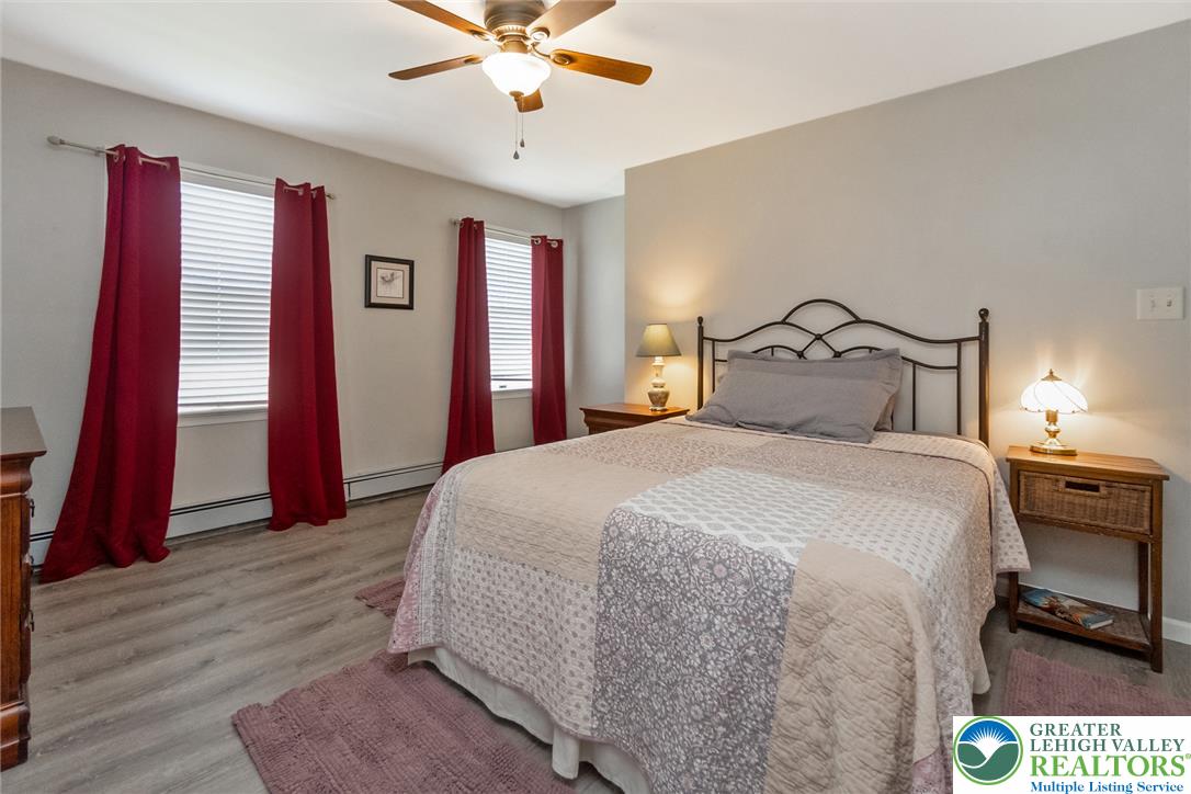 9461 Red Road Kempton, PA 19529 - Photo 30 of 55 Well-lit room featuring a warm ceiling fan, and multiple windows.