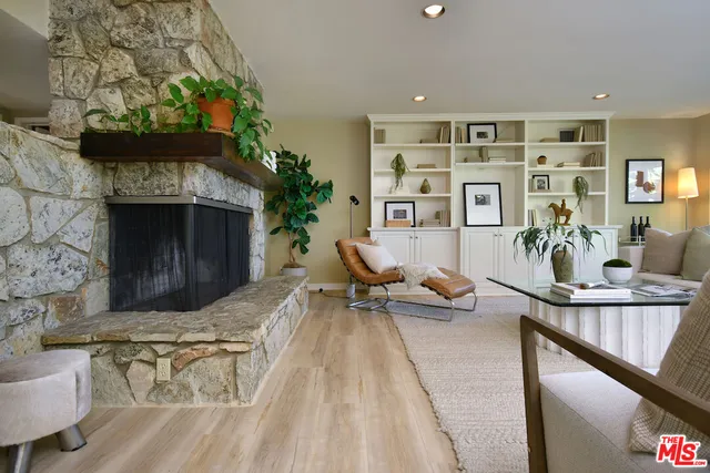 a living room with furniture and large window