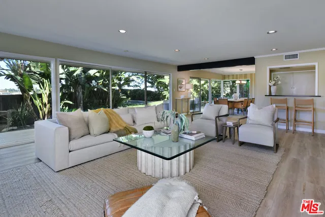 a view of a dining room with furniture window and outside view
