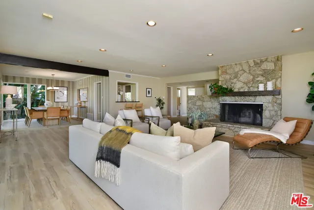 a view of a dining room with furniture wooden floor and chandelier