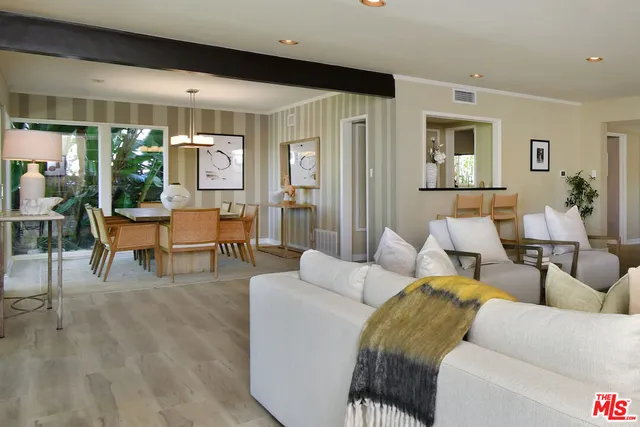 a view of a kitchen cabinets and chandelier