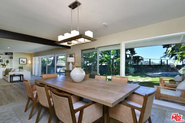 a kitchen with stainless steel appliances kitchen island granite countertop a sink and a stove