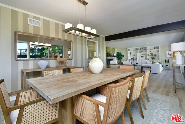 a spacious bathroom with a granite countertop sink a toilet and a mirror