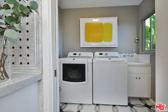 a bedroom with a bed and glass window