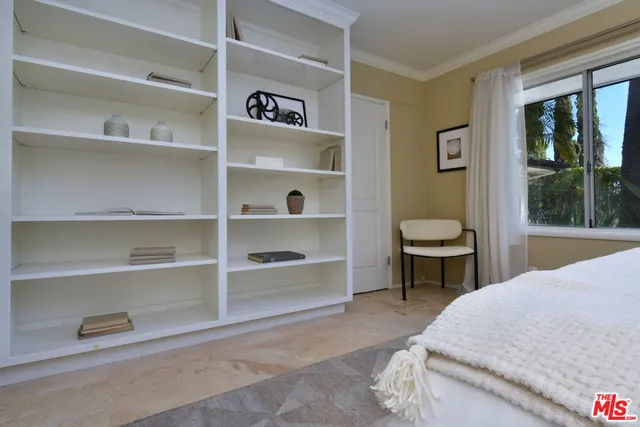 a view of a livingroom with furniture and a mirror