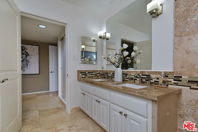 a view of a yard with plants and a tree