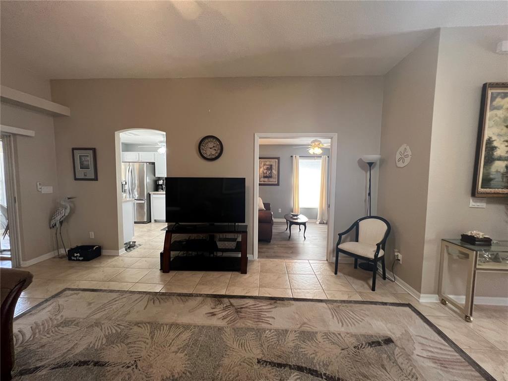 24472 Manchester Trail Punta Gorda, FL 33980 - Photo 12 of 46 a living room with furniture and a flat screen tv