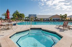 24472 Manchester Trail Punta Gorda, FL 33980 - Photo 35 of 46 swimming pool view with a seating space and a garden view