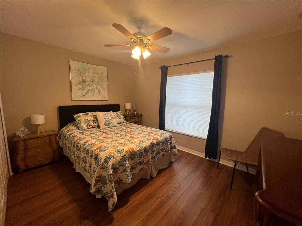 24472 Manchester Trail Punta Gorda, FL 33980 - Photo 7 of 46 a bedroom with a bed and wooden floor