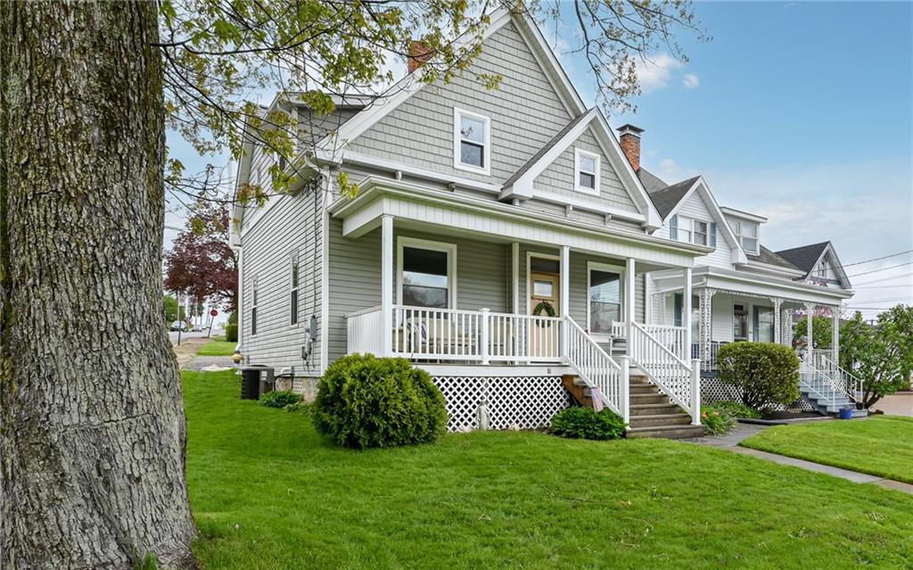 a view of a house with a yard and plants