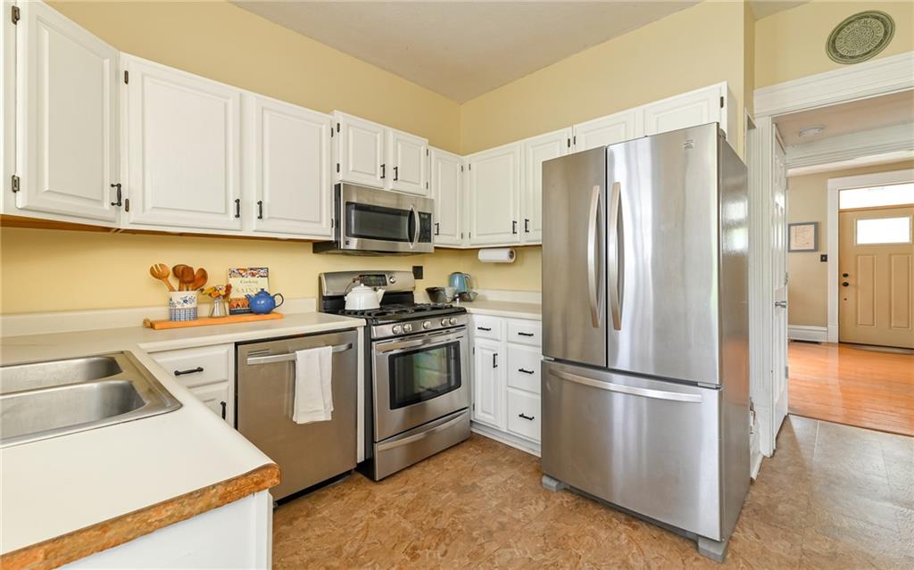516 Pittsburgh Street Mars, PA 16046 - Photo 11 of 21 a kitchen with appliances a refrigerator and a sink