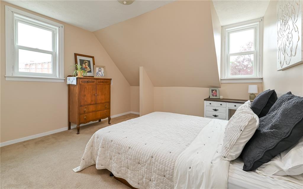 516 Pittsburgh Street Mars, PA 16046 - Photo 17 of 21 a bedroom with a bed and wooden floor