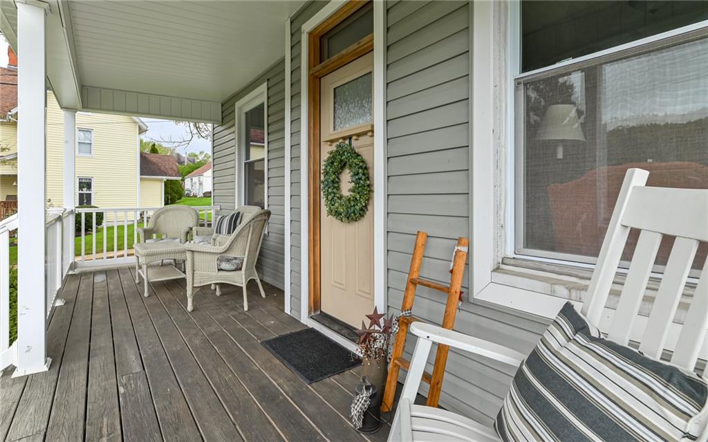 516 Pittsburgh Street Mars, PA 16046 - Photo 3 of 21 a balcony with chairs and wooden floor