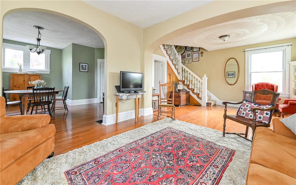 516 Pittsburgh Street Mars, PA 16046 - Photo 8 of 21 a living room with furniture a rug and a flat screen tv