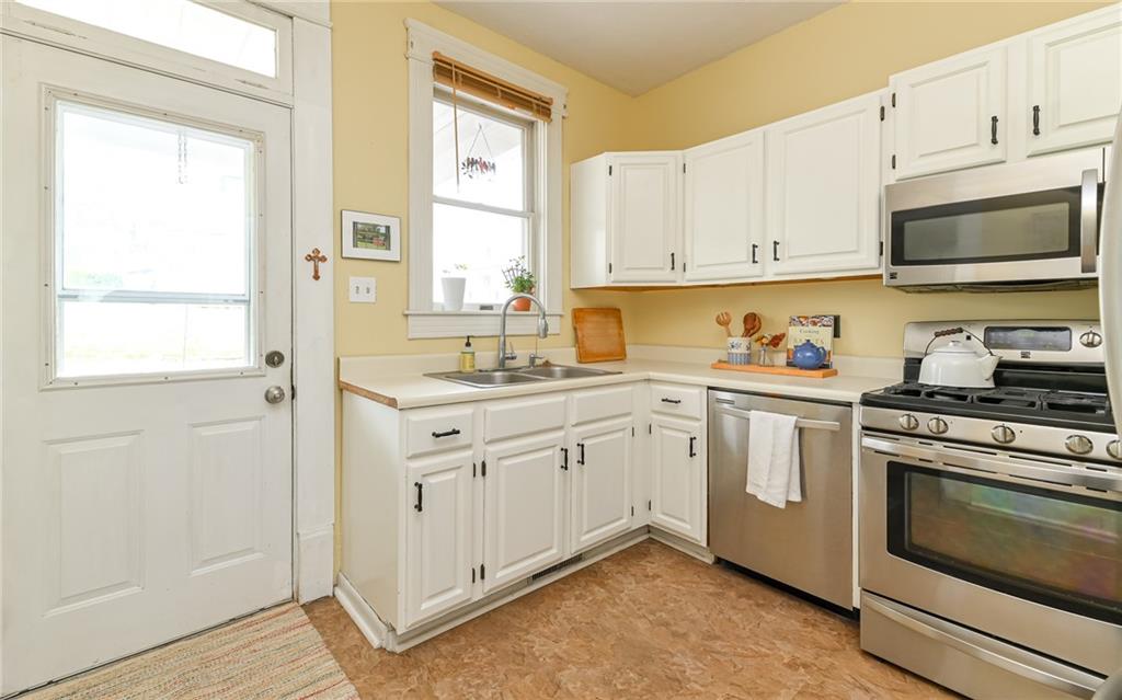 516 Pittsburgh Street Mars, PA 16046 - Photo 10 of 21 a kitchen with granite countertop white cabinets stainless steel appliances and sink