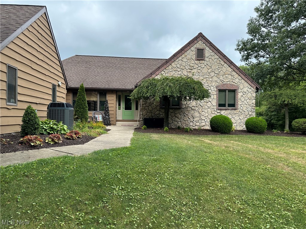 354 Big Bass Road Willard, OH 44890 - Photo 1 of 29 View of front of house with central AC and a front lawn