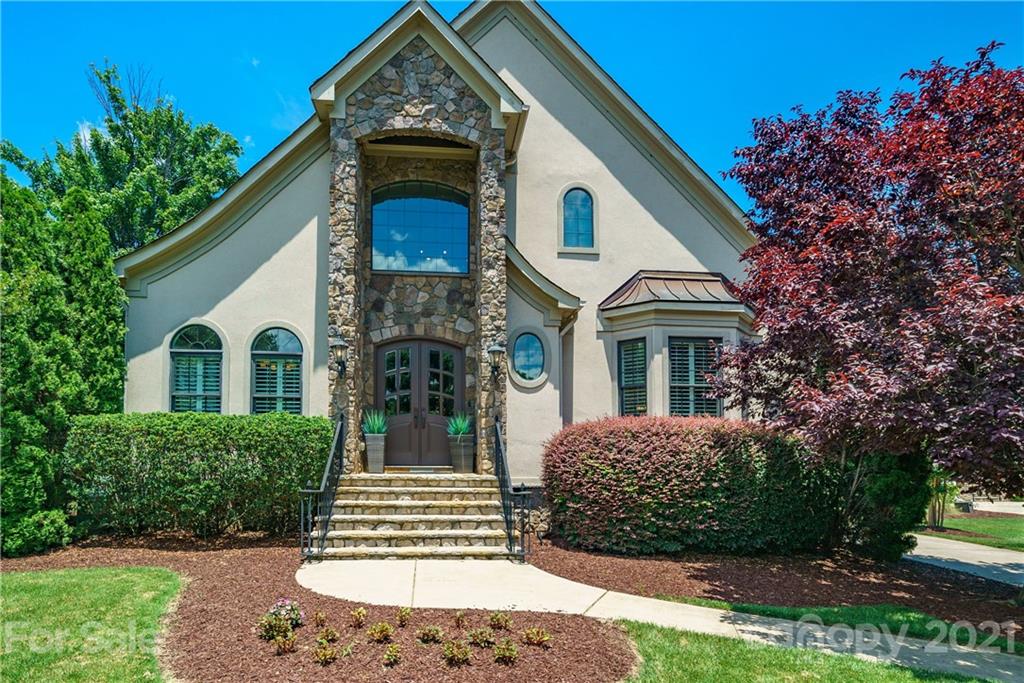 17405 Sail View Drive Cornelius, NC 28031 - Photo 1 of 43 a front view of a house with garden