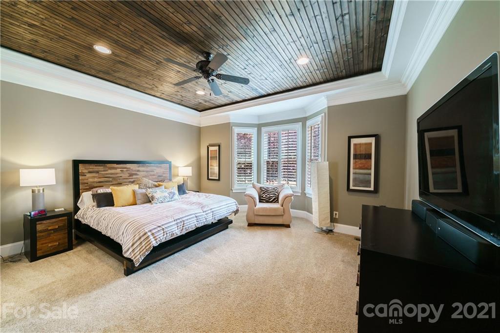 17405 Sail View Drive Cornelius, NC 28031 - Photo 15 of 43 a bedroom with a bed couch and window