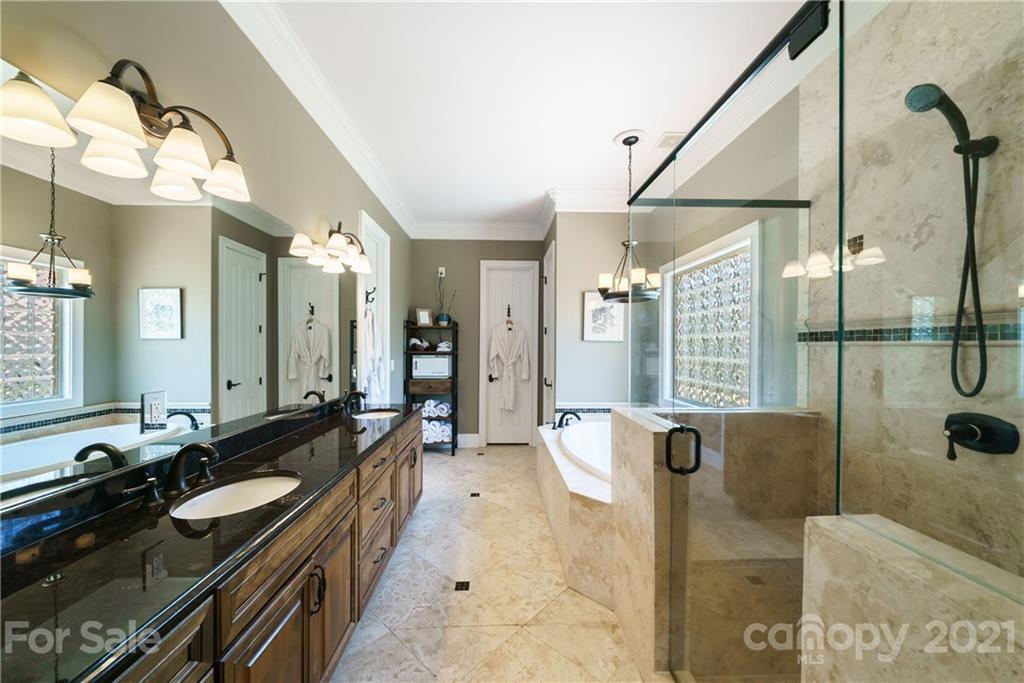 17405 Sail View Drive Cornelius, NC 28031 - Photo 17 of 43 a large bathroom with a tub sink and mirror