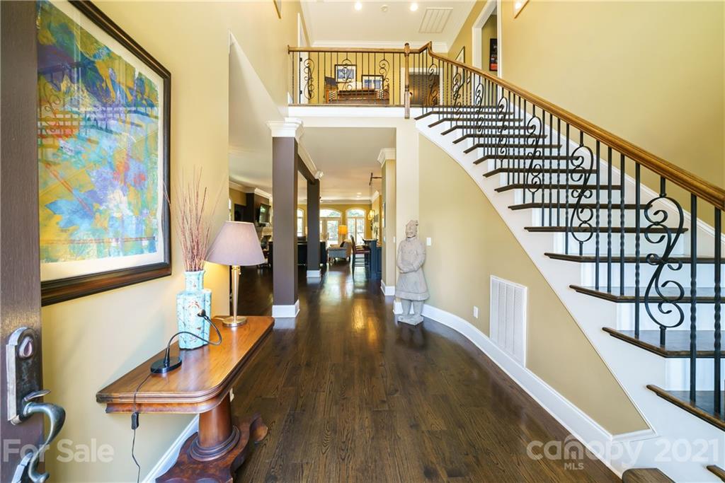 17405 Sail View Drive Cornelius, NC 28031 - Photo 3 of 43 a dining room with wooden floor and furniture