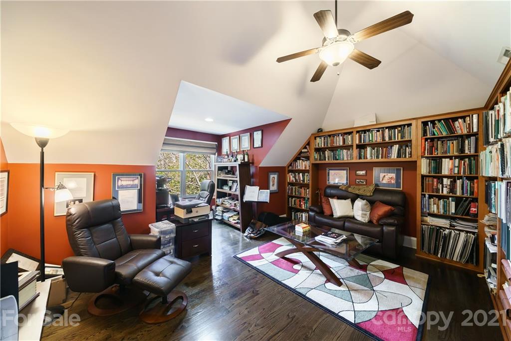 17405 Sail View Drive Cornelius, NC 28031 - Photo 23 of 43 a living room with furniture a bookshelf and a window