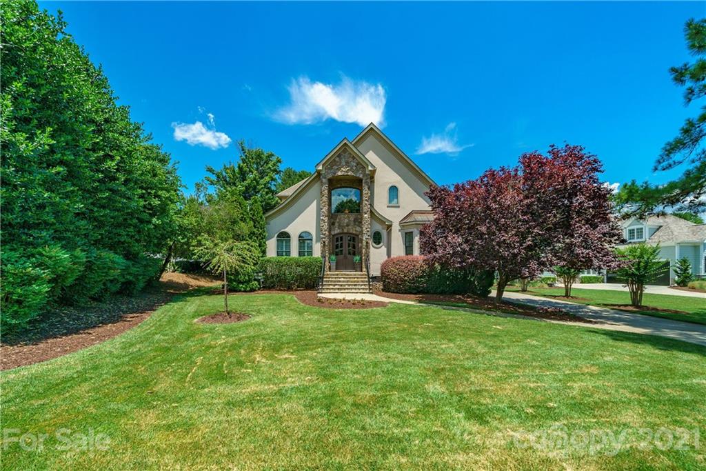 17405 Sail View Drive Cornelius, NC 28031 - Photo 33 of 43 a front view of a house with a yard and garage