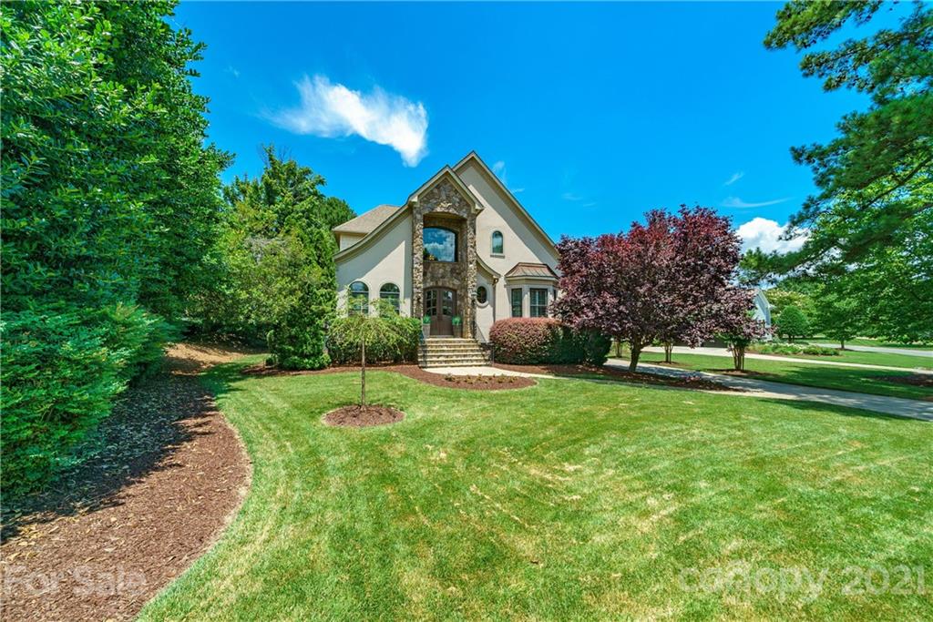 17405 Sail View Drive Cornelius, NC 28031 - Photo 34 of 43 a front view of a house with a yard and trees