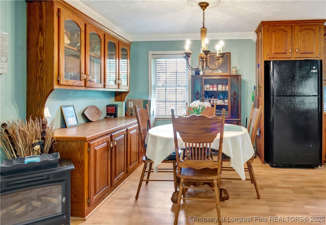 1079 Charlie Williamson Road Whiteville, NC 28472 - Photo 18 of 35 a dining room with furniture and window