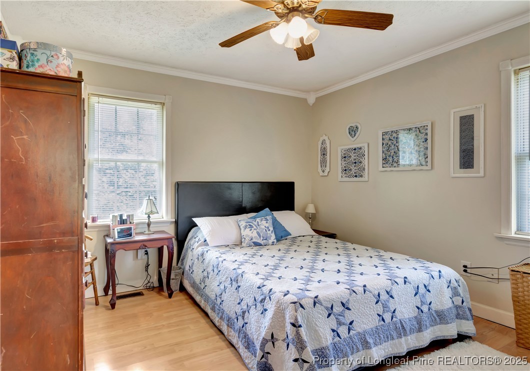 1079 Charlie Williamson Road Whiteville, NC 28472 - Photo 19 of 35 a bedroom with a large bed and a window