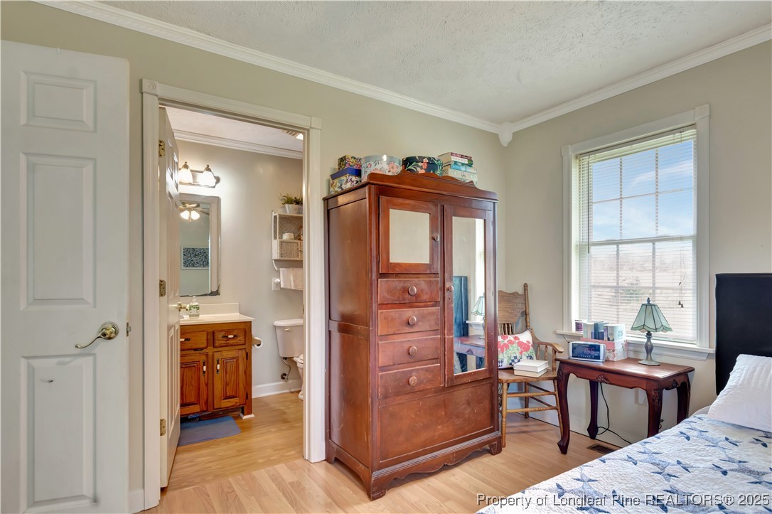 1079 Charlie Williamson Road Whiteville, NC 28472 - Photo 20 of 35 a bedroom with furniture and a closet
